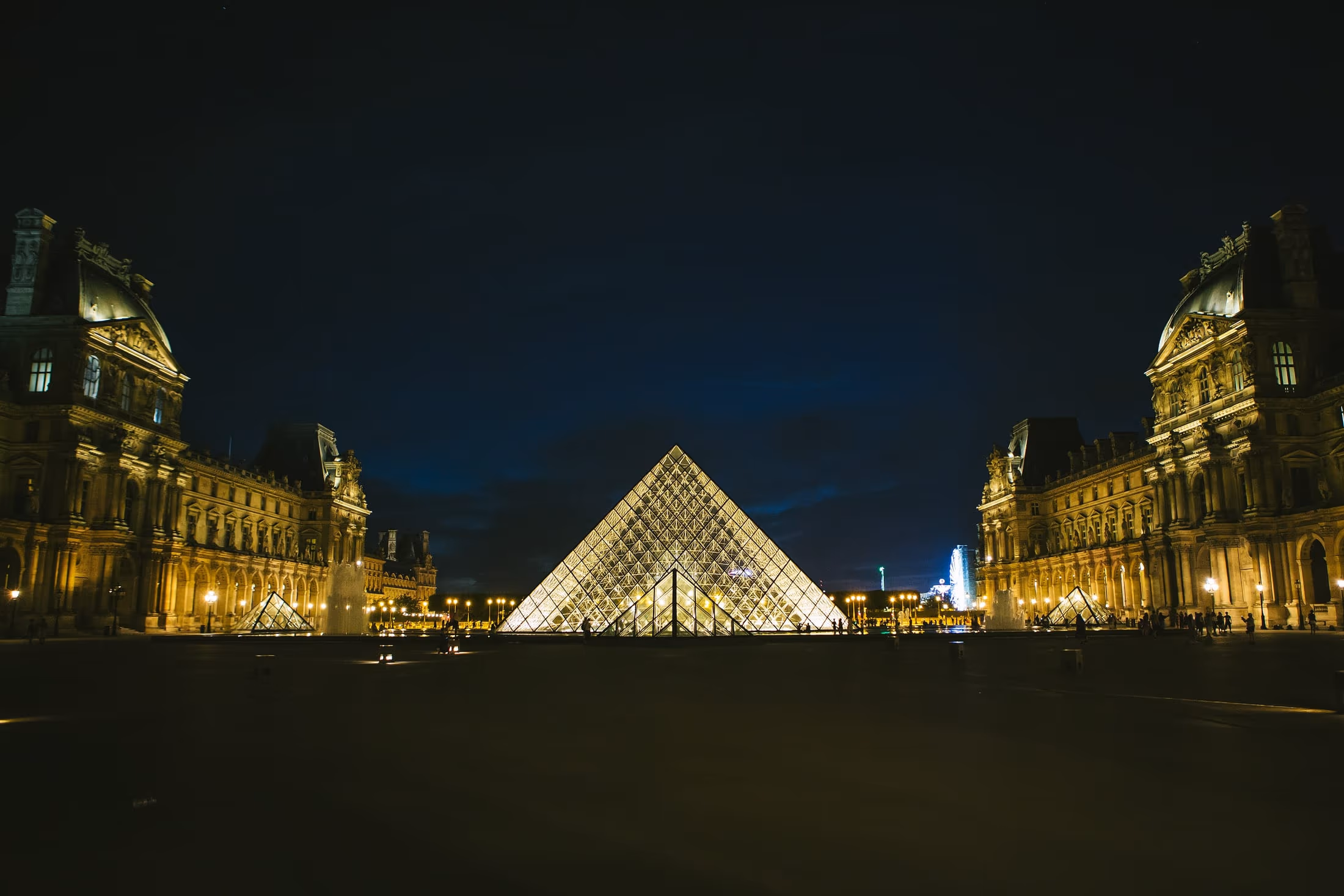 The Louvre pyramid illuminated after dark